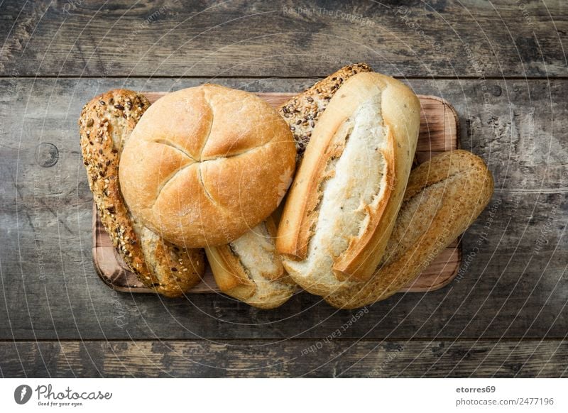 Mixed bread on wooden table Top view Bread Cereal Food Healthy Eating Flour Home-made Breakfast Brown Dinner Bakery Toast Nutrition Organic Consistency Fresh