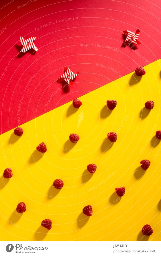 Fresh raspberries on yellow and red background Fruit Dessert Nutrition Vegetarian diet Diet Bowl Summer Nature Delicious Natural Juicy Yellow Red Colour