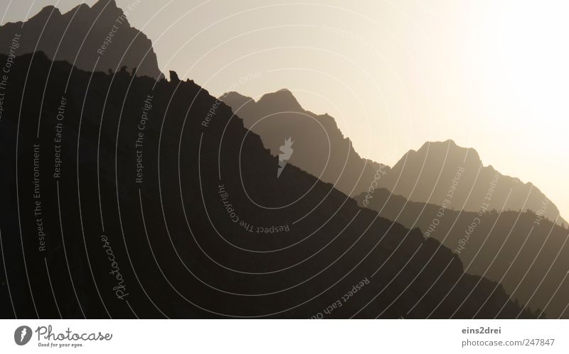 mountain silhouette Relaxation Meditation Vacation & Travel Mountain Climbing Mountaineering Nature Landscape Cloudless sky Sunrise Sunset Beautiful weather