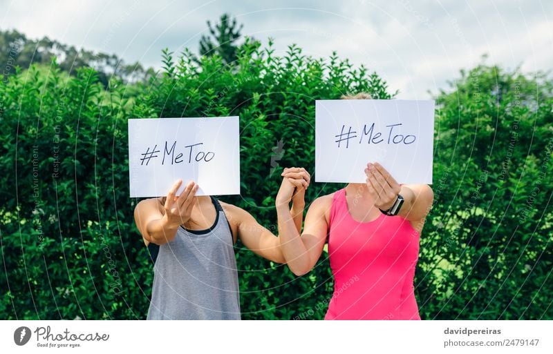 Women showing poster with metoo hashtag Human being Woman Adults Hand Cinema Plant Aggression Authentic Force me too support Hold empowerment sexual harassment