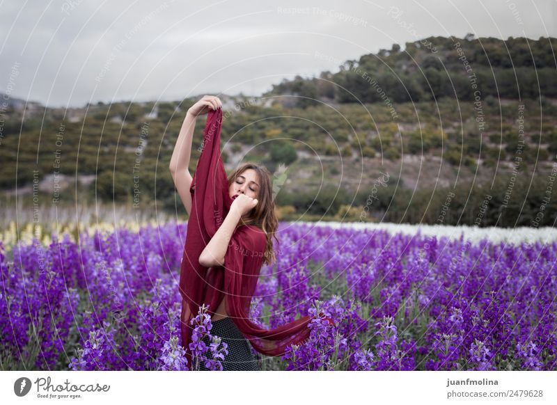 Girl in flower field with handkerchief Lifestyle Young woman Youth (Young adults) 18 - 30 years Adults Hair and hairstyles Blue Green Violet White Colour photo