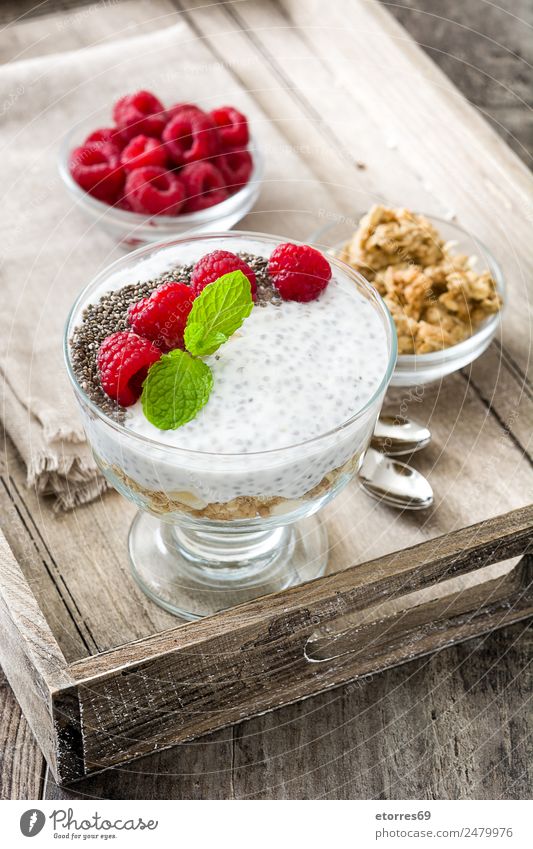 Chia yogurt with raspberries in a glass cup on wood chia Yoghurt Raspberry Dairy Fruit Healthy Healthy Eating Vegan diet Vegetarian diet superfood Natural