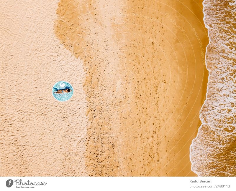 Top Aerial Drone View Of Woman In Swimsuit Bikini Relaxing And Sunbathing On Round Turquoise Beach Towel Near The Ocean Vantage point Aircraft Summer