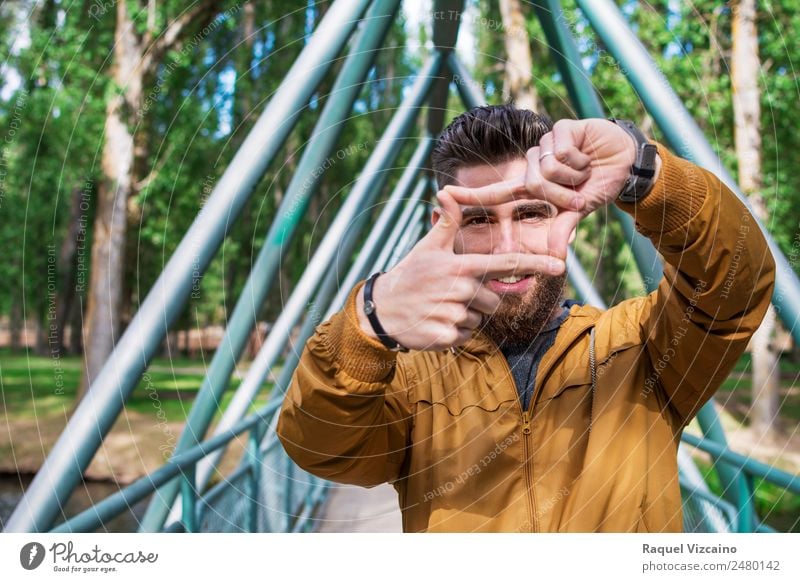 young man simulating a photographic frame with his hands Lifestyle Vacation & Travel Human being Masculine Young man Youth (Young adults) Face Eyes Hand 1