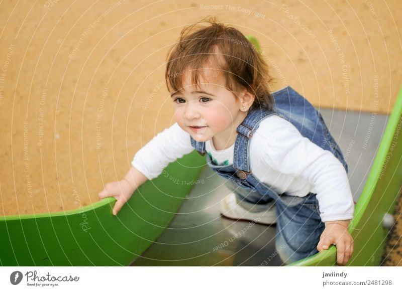 Happy little girl playing in a urban playground Lifestyle Joy Beautiful Leisure and hobbies Playing Summer Climbing Mountaineering Child Human being Baby Girl