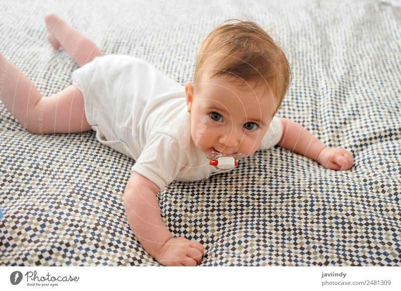 Happy baby girl, four months old, on the bed with pacifier. Beautiful Face Life Child Human being Baby Girl Infancy 1 0 - 12 months Smiling Sleep Small New Cute