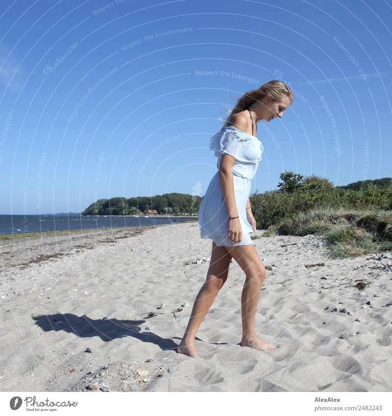 Young woman walks on the beach Style pretty Well-being Summer Summer vacation Sun Sunbathing Beach Ocean Youth (Young adults) Legs 18 - 30 years Adults