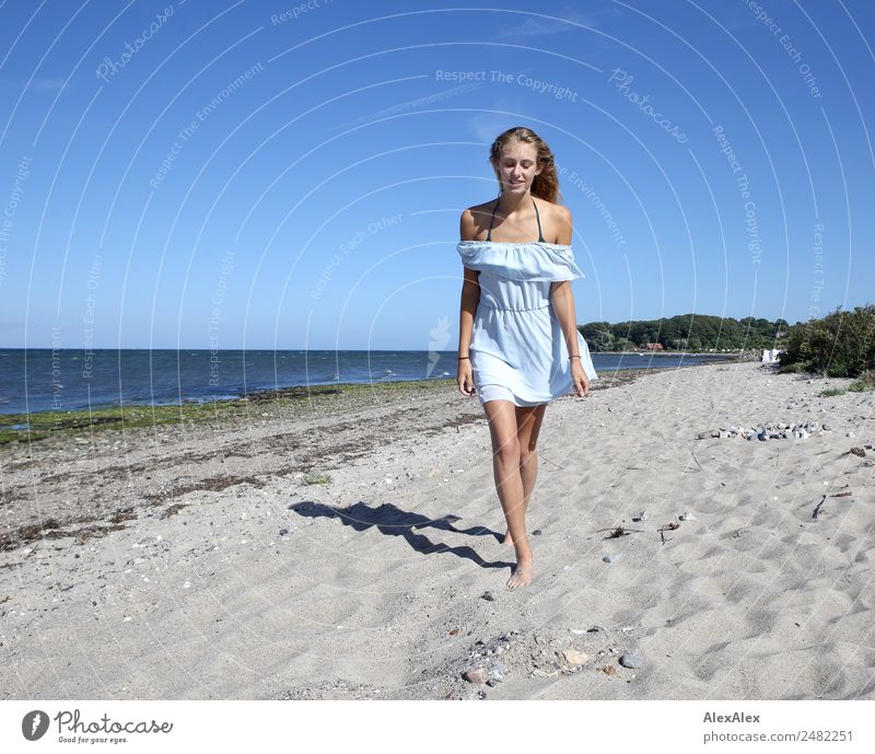 Young woman walks up to someone at the Baltic beach Elegant pretty Life Summer Summer vacation Sun Sunbathing Beach Ocean Youth (Young adults) 18 - 30 years