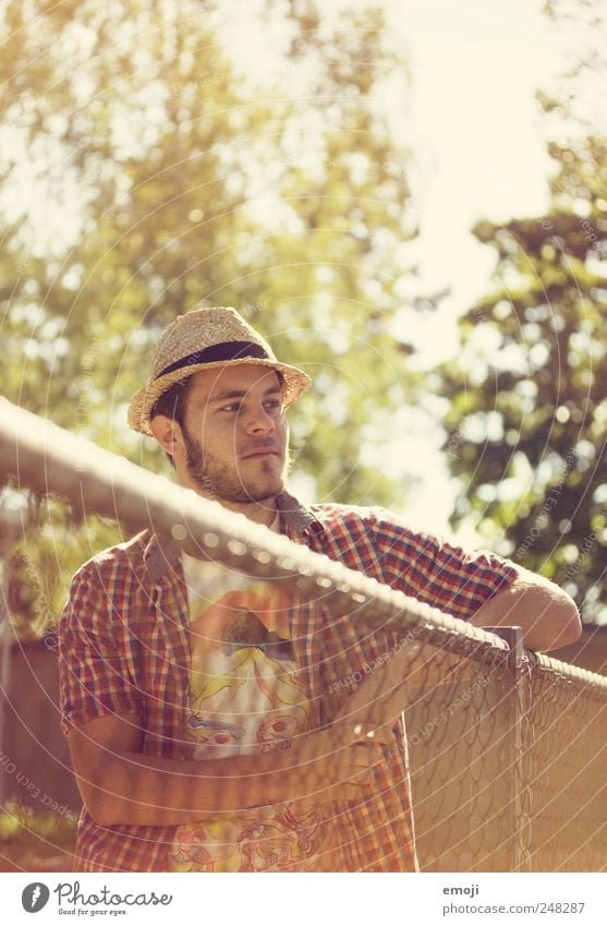 those sunny days I'll remember Leisure and hobbies Masculine 1 Human being Summer Accessory Hat Yellow Hot Wire fence Wire netting fence Fence Cool (slang)