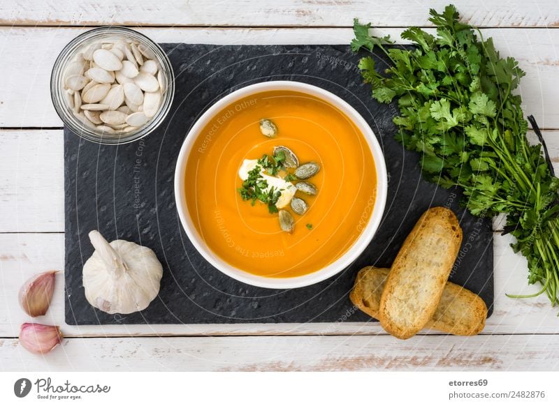 Pumpkin soup Food Vegetable Bread Soup Stew Lunch Bowl Thanksgiving Good Orange Healthy Eating Ingredients Garlic Parsley Seed Wooden table Vegetarian diet