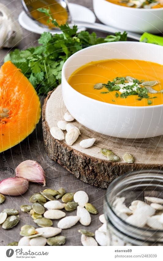 Pumpkin soup Food Vegetable Soup Stew Nutrition Lunch Organic produce Vegetarian diet Diet Bowl Thanksgiving Good Orange Seed Ingredients Wooden table