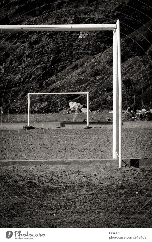 gates Sports Ball sports Soccer Sporting Complex Football pitch Earth Sand Hill Rock Mountain Competition Playing Empty Black & white photo Exterior shot