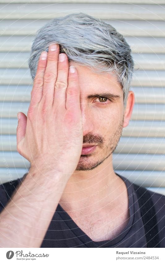 Portrait of man covering an eye with his hand Lifestyle Hair and hairstyles Face Human being Masculine Young man Youth (Young adults) 1 18 - 30 years Adults