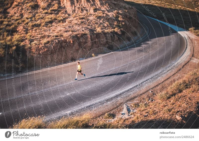 Young man running with greenish yellow shirt Lifestyle Sun Sports Jogging Human being Man Adults Park Bridge Movement Fitness Athletic Speed White young healthy