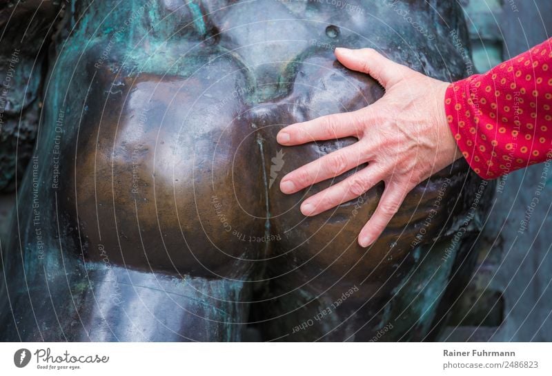 the hand of a woman touches the naked bottom of a statue Feminine Woman Adults Hand 1 Human being Art Sculpture Touch Sex Eroticism Voluptuousness "Harassment