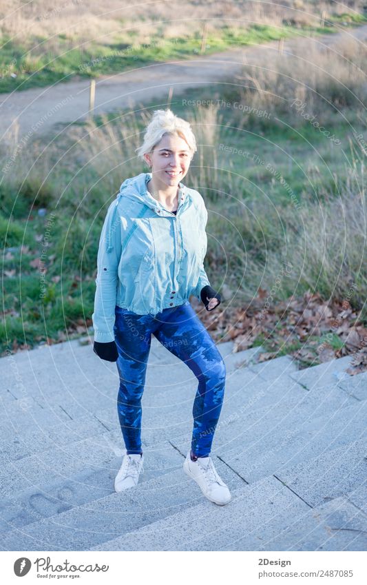 Portrait of a young woman walks outdoor as workout Lifestyle Happy Beautiful Leisure and hobbies Sports Track and Field Jogging Work and employment Human being