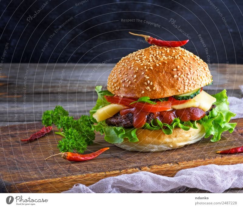 fresh homemade burger Meat Cheese Vegetable Bread Roll Lunch Fast food Table Restaurant Wood Eating Fresh Large Delicious Green Red Black Hamburger Cheeseburger