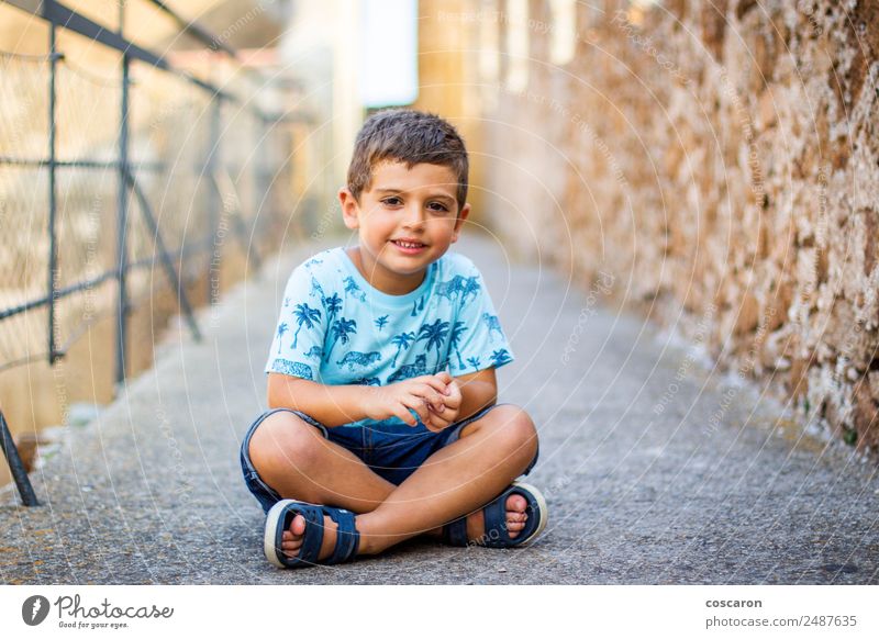 Cute little boy seated on the wall of a castle Lifestyle Beautiful Vacation & Travel Tourism Trip Summer vacation Child Baby Toddler Boy (child) Infancy 1