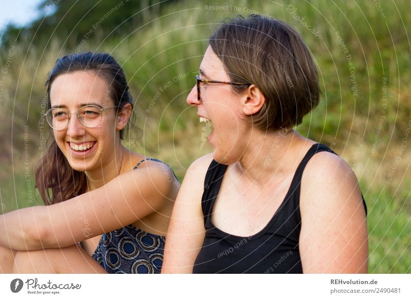 2 sisters laughing in nature Young woman Adults Friendship Brothers and sisters Joy Happy Laughter Authentic Exterior shot Colour photo Day Together Love Trust