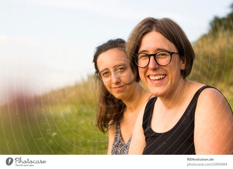 two sisters in the meadow Lifestyle Harmonious Well-being Contentment Leisure and hobbies Trip Human being Feminine Brothers and sisters Sister