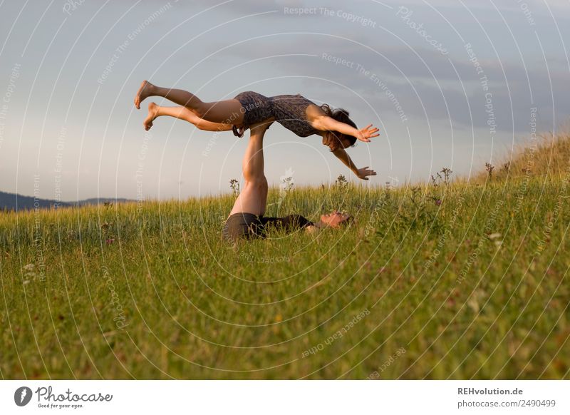 2 young women on the meadow Lifestyle Healthy Athletic Fitness Leisure and hobbies Human being Young woman Youth (Young adults) Brothers and sisters Sister