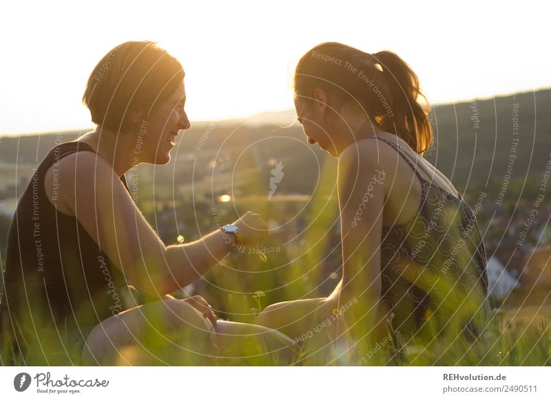 2 young women sitting on the meadow Brothers and sisters Couple Youth (Young adults) Human being Adults Leisure and hobbies Nature Landscape 18 - 30 years