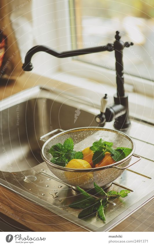 fresh mint and lemons on the kitchen Fruit Herbs and spices Juice Kitchen Nature Plant Leaf Fresh Juicy Sour Yellow Green Colour citrus Cut healthy wash