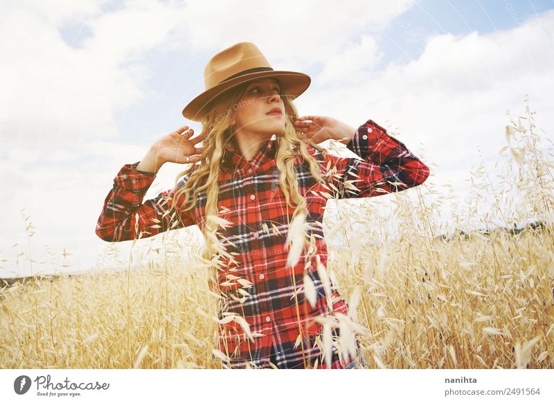 Young woman in a wheat field Lifestyle Style Beautiful Healthy Vacation & Travel Adventure Freedom Agriculture Forestry Human being Feminine