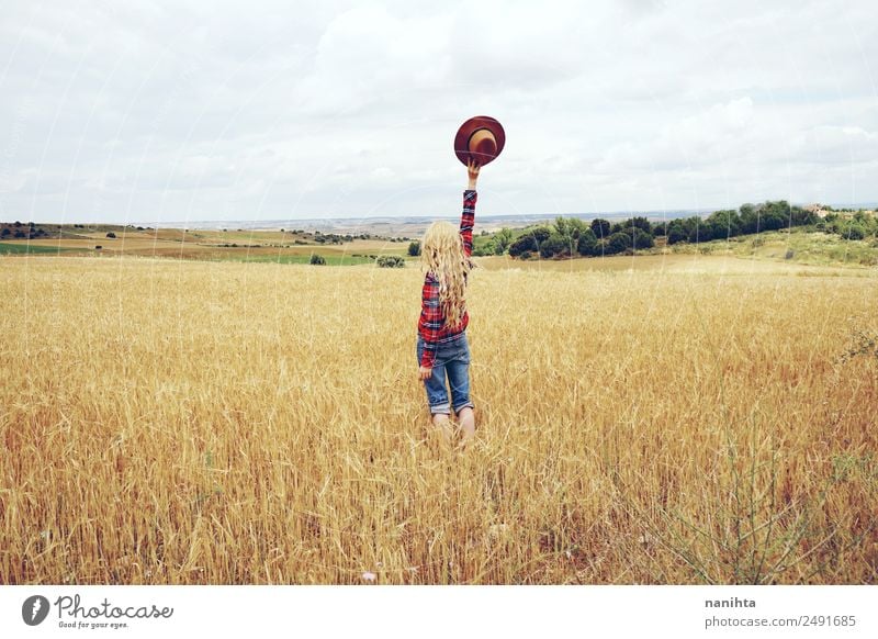 Young woman alone in a field of wheat Grain Lifestyle Style Joy Healthy Wellness Harmonious Well-being Freedom Summer Human being Feminine Youth (Young adults)