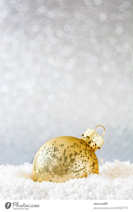 Christmas ball on snow and silver glitter background Vacation & Travel Snow Decoration Party Feasts & Celebrations Christmas & Advent Ball Sphere Gold Green