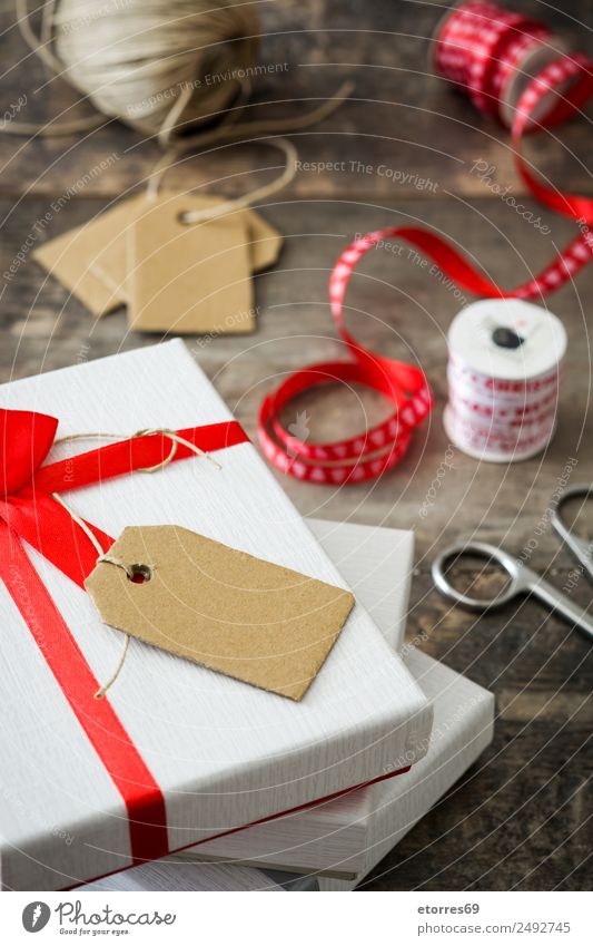 White gift box with label on wooden table. Vacation & Travel Interior design Decoration Feasts & Celebrations Valentine's Day Christmas & Advent Birthday