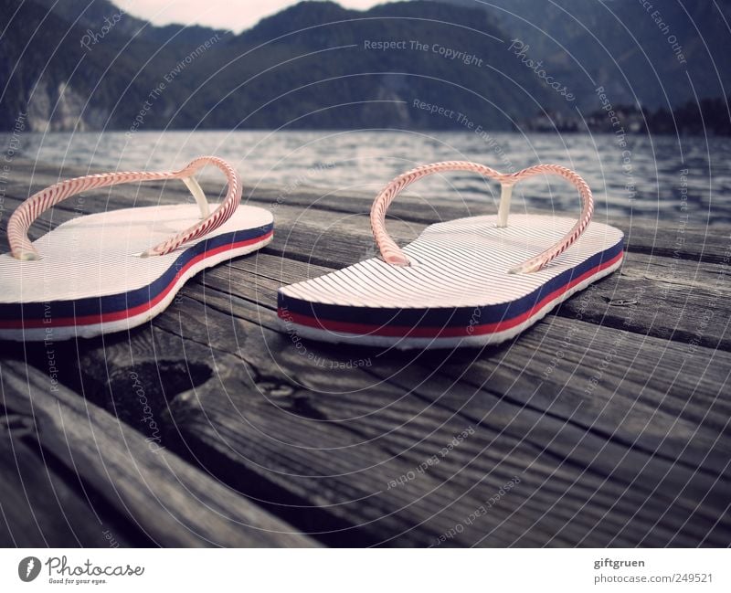 gone swimming Environment Nature Landscape Elements Water Mountain Waves Lakeside Swimming & Bathing Footbridge Wood Knothole Flip-flops Beach shoes Stripe