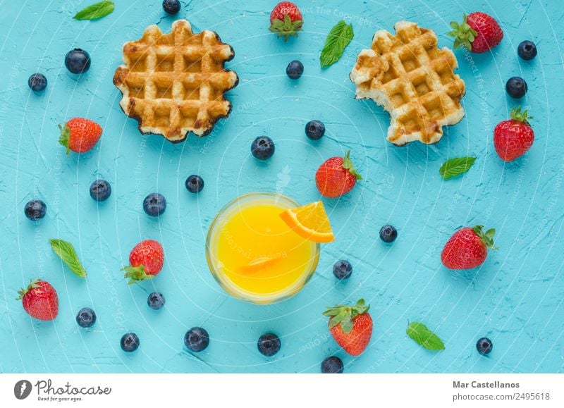 Waffles, red berries, mint leaves and orange juice Fruit Dessert Nutrition Breakfast Lunch Vegetarian diet Diet Lifestyle Summer Table Write Delicious Above