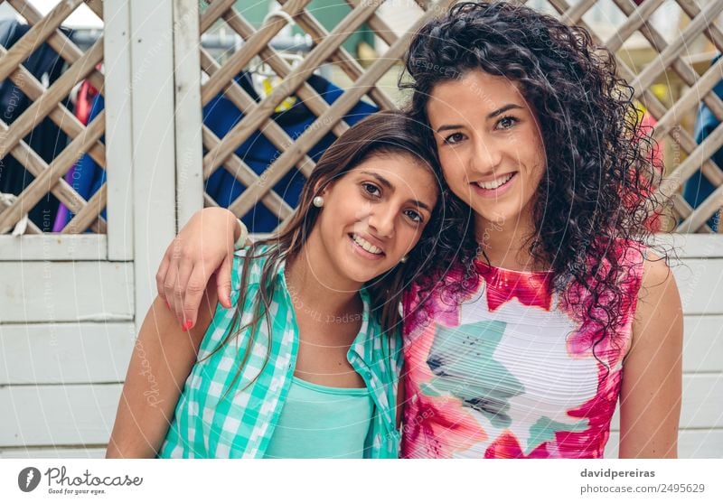 Happy women looking at camera over garden fence Lifestyle Joy Face Leisure and hobbies Summer Garden Human being Woman Adults Friendship Brunette Wood To enjoy