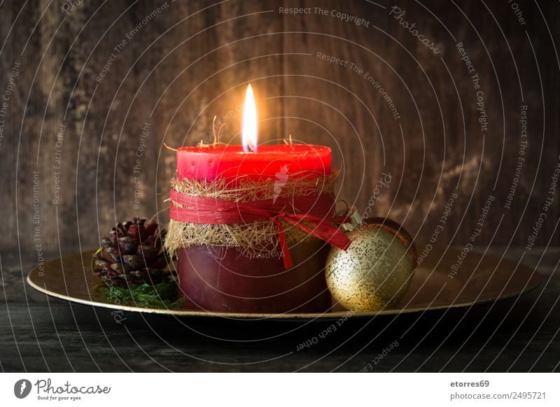 Christmas candles on wooden background. Christmas & Advent Candle Red Serene Calm Decoration Ornament Fire Wooden table Feasts & Celebrations Seasons Winter