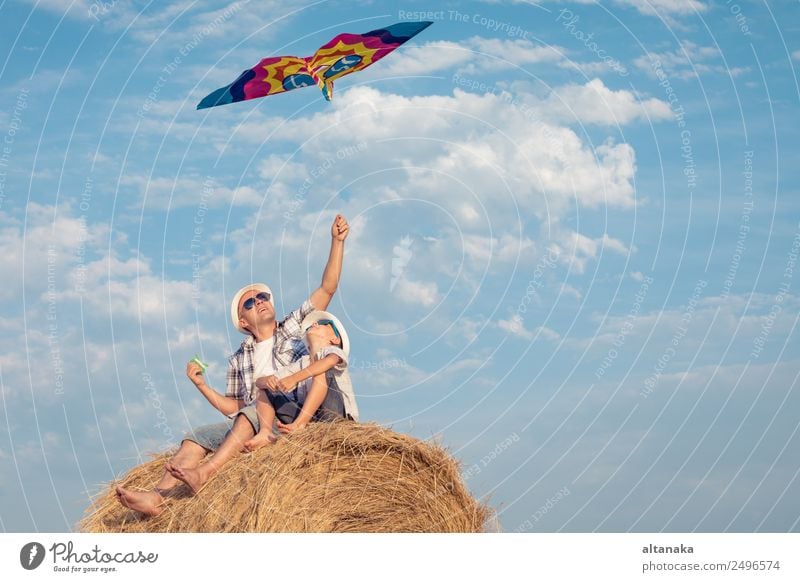 Father and son playing in the park Lifestyle Joy Happy Leisure and hobbies Playing Vacation & Travel Freedom Summer Sports Child Human being Boy (child) Man