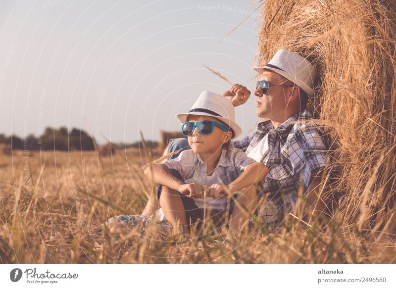 Father and son playing in the park Lifestyle Joy Happy Leisure and hobbies Playing Vacation & Travel Freedom Summer Sports Child Human being Boy (child) Man