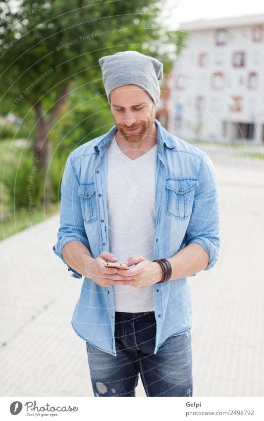 Casual guy Lifestyle Style Joy Happy Leisure and hobbies Telephone PDA Technology Human being Man Adults Street Fashion Shirt Hat Beard Listening Smiling Write