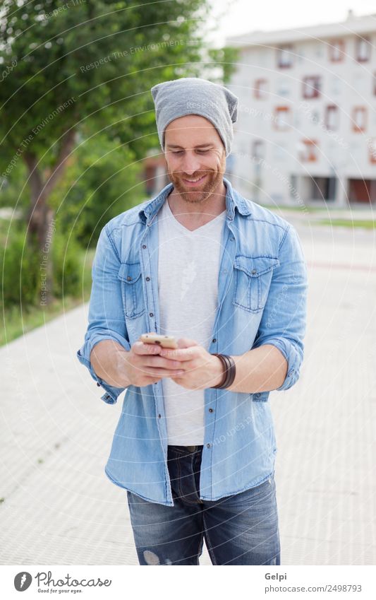 Casual guy Lifestyle Style Joy Happy Leisure and hobbies Telephone PDA Technology Human being Man Adults Street Fashion Shirt Hat Beard Listening Smiling Write