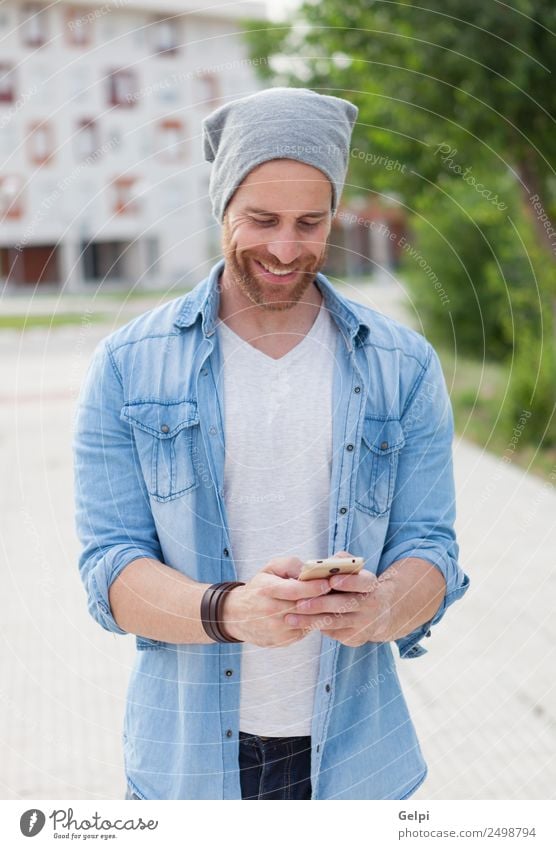 Casual guy Lifestyle Style Joy Happy Leisure and hobbies Telephone PDA Technology Human being Man Adults Street Fashion Shirt Hat Beard Listening Smiling Write