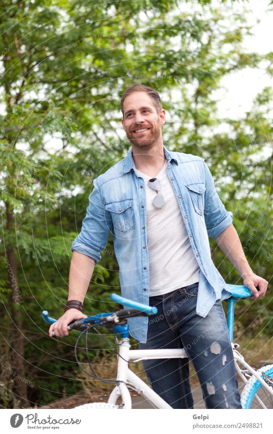 Casual guy Lifestyle Joy Happy Leisure and hobbies Vacation & Travel Summer Sports Cycling Human being Man Adults Nature Park Transport Street To enjoy Smiling