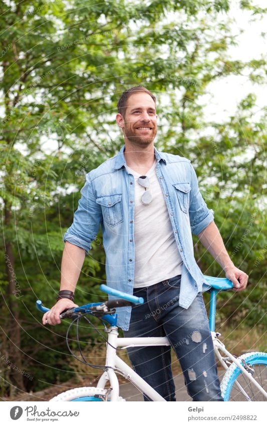 Casual guy Lifestyle Joy Happy Leisure and hobbies Vacation & Travel Summer Sports Cycling Human being Man Adults Nature Park Transport Street To enjoy Smiling