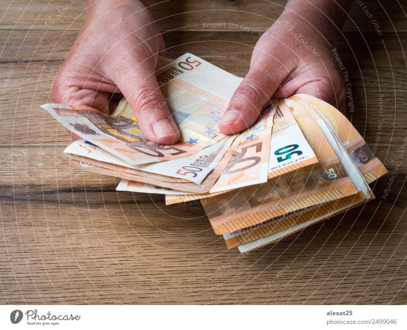 Woman hands with group of fifty euros banknotes Shopping Money Save Success Economy Financial Industry Business Adults Hand Paying Rich White background