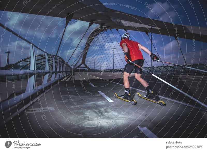 A young man cross-country skiing with roller ski Lifestyle Style Relaxation Summer Sports Man Adults Feet Street Movement Speed Competition Cross-country