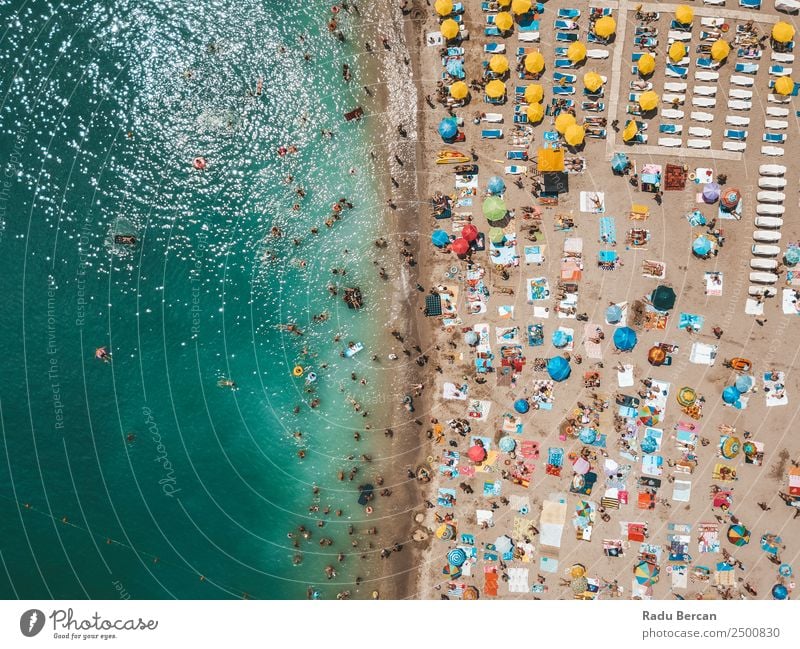 Aerial View From Flying Drone Of People Crowd Relaxing On Beach In Romania At The Black Sea Aircraft Vantage point Sand Background picture Water Above Ocean