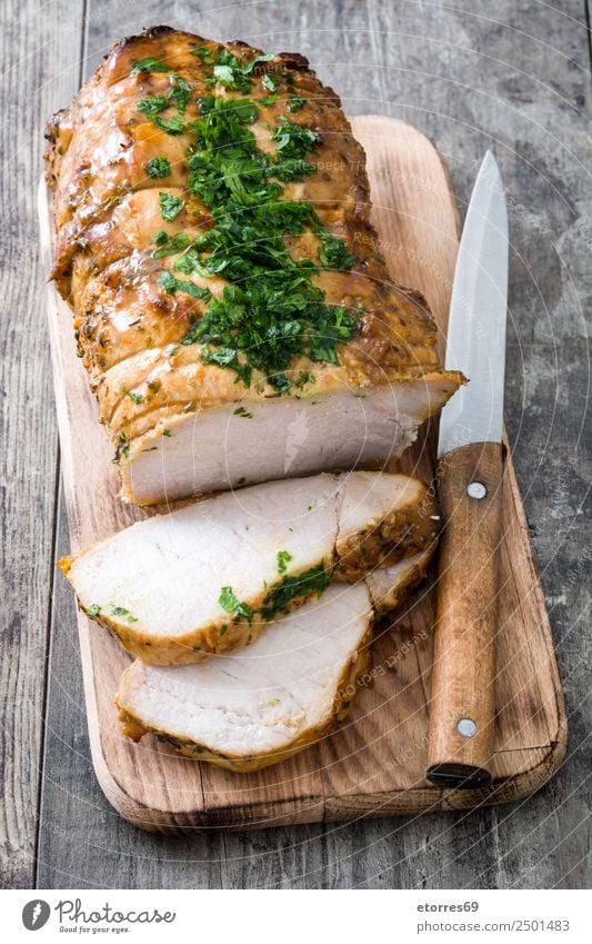 Roasted pork on wooden table Pork BBQ Barbecue (apparatus) Barbecue (event) Home-made Christmas & Advent Tradition Loin Meal Food Healthy Eating Food photograph