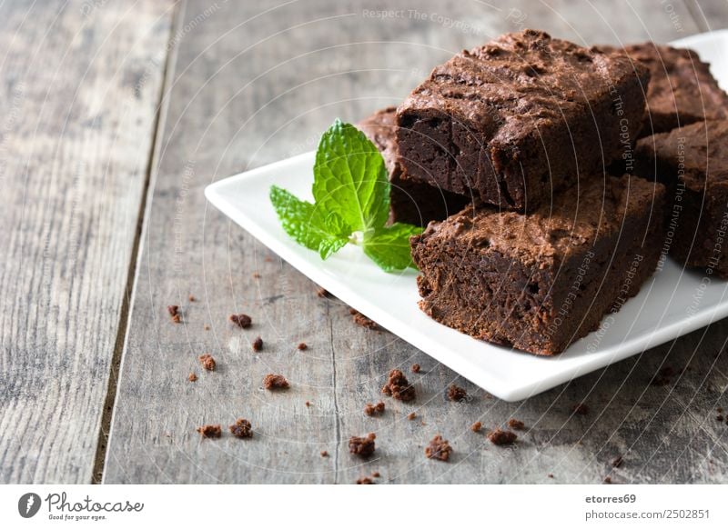 Chocolate brownie pieces on wooden background Brown Browns Confectionary Sweet Dessert Baked goods Cake nut walnuts Food Food photograph Snack Delicious Baking