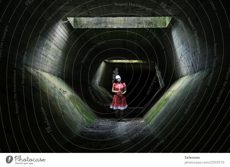 in the tunnel Tunnel Human being Creepy creepy Hallowe'en Fear Dark Adults Exterior shot Colour photo Shadow Woman Feminine somber Mask Dangerous Front view