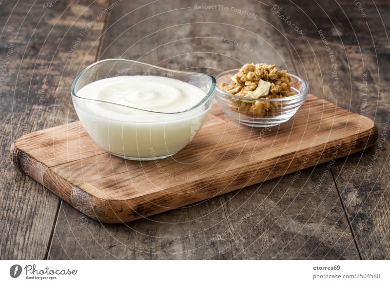 Greek yogurt in glass bowl on wooden table Food Yoghurt Dairy Products Fruit Dessert Candy Nutrition Organic produce Diet Bowl Wood Glass Natural White