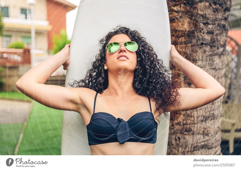 Brunette surfer woman in bikini standing with surfboard Lifestyle Joy Happy Beautiful Leisure and hobbies Vacation & Travel Summer Beach Ocean Garden Sports